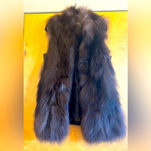 Channel mob wife vibes with this Michael Kors fur and leather vest